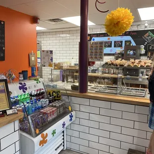 a woman standing in front of a counter