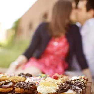 a couple kissing in the background