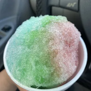 a person holding a bowl of ice cream