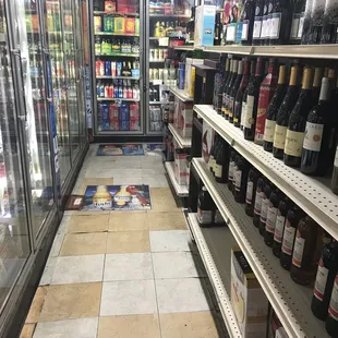 the aisle of a wine store