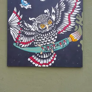 an owl on a skateboard