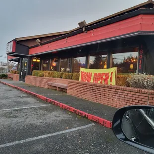 a red building with a sign that says peace of mind