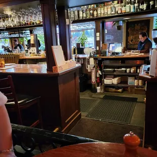 a woman sitting at a bar