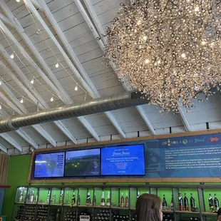 a large chandelier of wine bottles