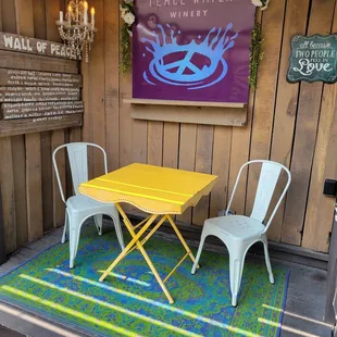 a yellow table and chairs