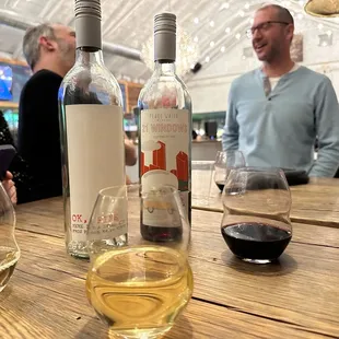 a group of people sitting at a table with wine glasses