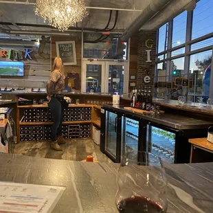 a woman standing in the tasting room