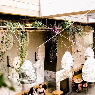 a woman sitting at a table in a restaurant