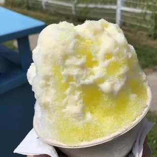 1/2 coconut 1/2 banana with condensed milk drizzled on top