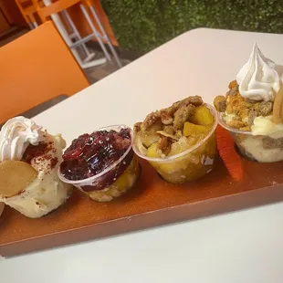 The flight- RED VELVET PUDDING, BLACKBERRY COBBLER, CARAMEL PEACH COBBLER, SNICKERDOODLE COOKIE pudding