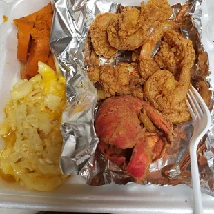Fried Lobster with mac and cheese, yams and side of shrimp.