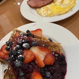 French toast with berries, eggs and ham