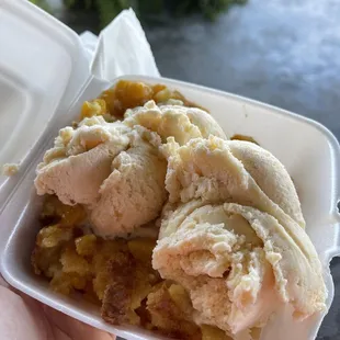 Peach ice cream over peach cobbler