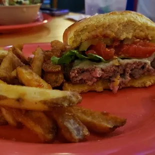 My sister&apos;s burger (awesome tomato included) and beer fries.
