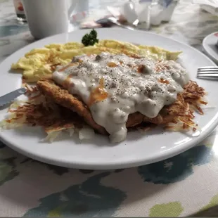 Chicken fried steak and gravy scrambled eggs crispy hash brown
