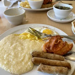 Cheeses grits, pork sausage, sunny side up eggs