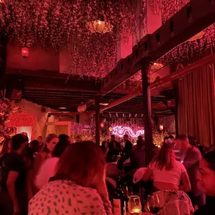 people sitting at tables in a restaurant