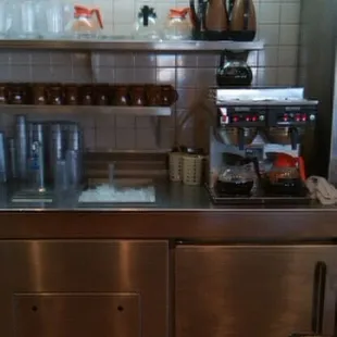 a kitchen with stainless steel counter tops