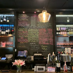 a bar with a chalkboard menu