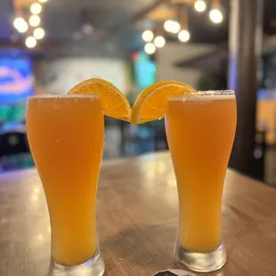 two glasses of orange juice