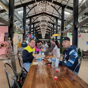 Some Flips enjoying that good ol&apos; American burgers and hot dog at this cool food hall, The Railway