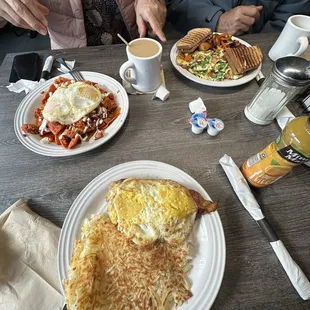 Red (because they didn&apos;t have green although it&apos;s on the menu) Chilaquiles, Avocado Toast, Denver Omelet