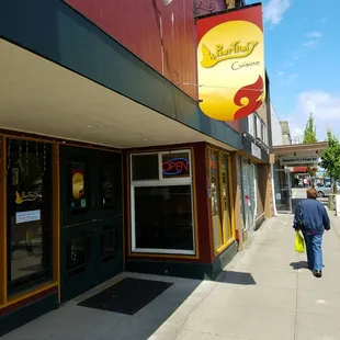 a man walking down the sidewalk