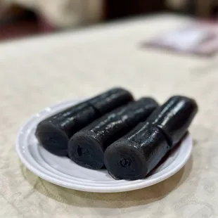 a plate of black tea sticks
