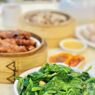 a bowl of spinach and other dishes