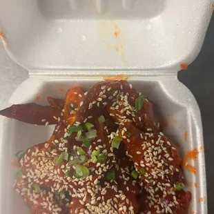 a take out container of a dish