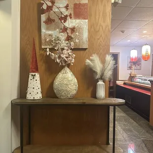 a table with vases on it