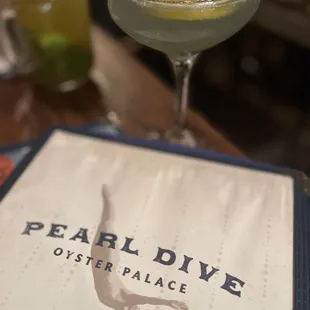 Fleur 75, a gin-based cocktail in the foreground and the back is the Pearl Cup, also a gin cocktail.... Delicious!