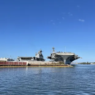 Two aircraft carriers parked at Pearl Harbor