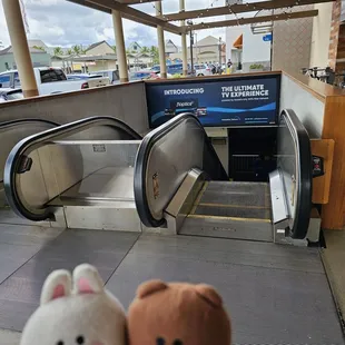 There are escalators that go down to Sam's Club downstairs