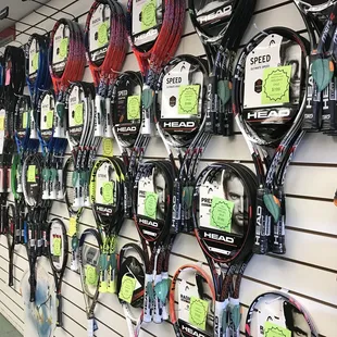 2 walls full of racquets: Babolat, Head, Wilson, Yonex, Prince!