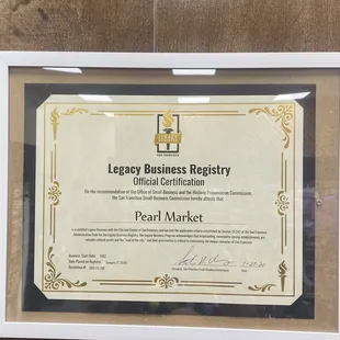 a framed certificate for a business