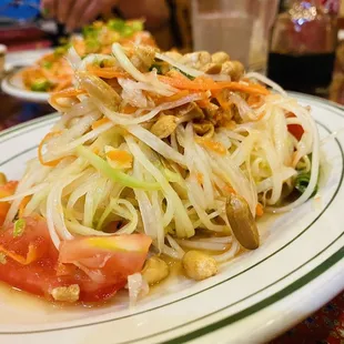 Papaya salad topped with roasted peanuts