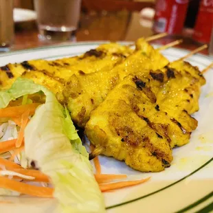 Chicken skewers served with peanut sauce