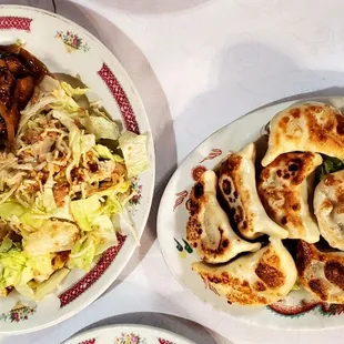 Combo: Mongolian Chicken, with chicken salad, and white rice. Order of 8 potstickers.