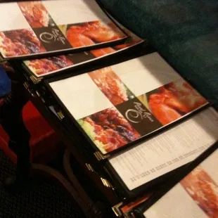 a stack of menus on a table