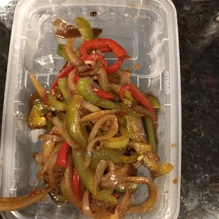 Onions and peppers ONLY.  Approximately 8-10 pc of beef in the dish