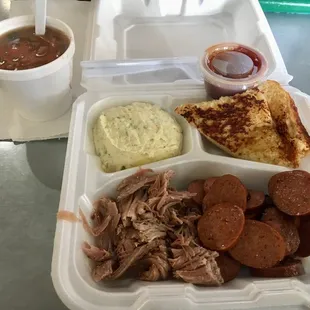 2 Meat plate $24 pulled pork, sausage, pinto beans, potato salad, jalapeño toast, bbq sauce