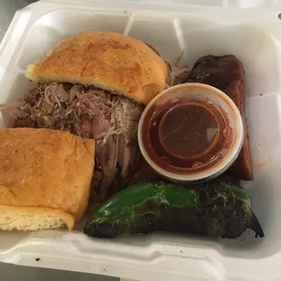 Bubba&apos;s Blowout $20 chopped brisket, pull pork n&apos; saus ,1 rib, grilled jalap, on a jalap. ched. sourdough bun, bbq sauce