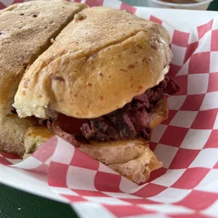 Sliced brisket on jalapeño bun.