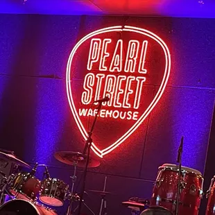 a neon sign on the wall