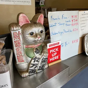 a cat figurine on a counter