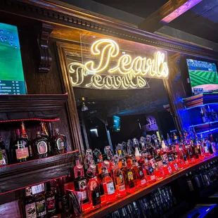 a bar with neon signs