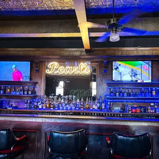 a bar with a neon sign