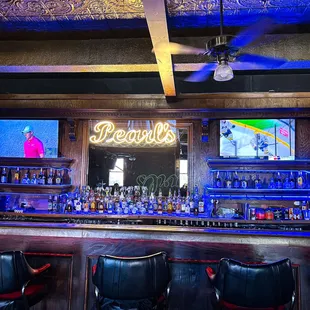 a bar with a neon sign