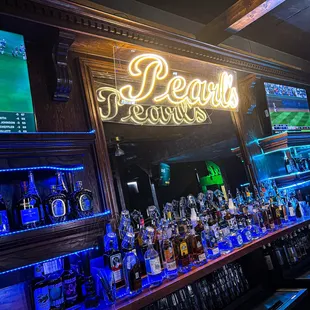 a bar with neon signs